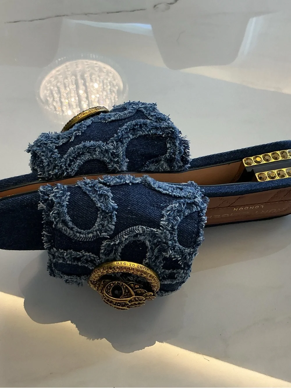 Kurt Geiger Distressed Denim Slide Mules with Gold Emblem